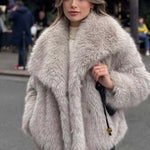 Plush winter coat for women, fluffy lapel jacket worn by a model in an urban setting, showcasing cozy style.