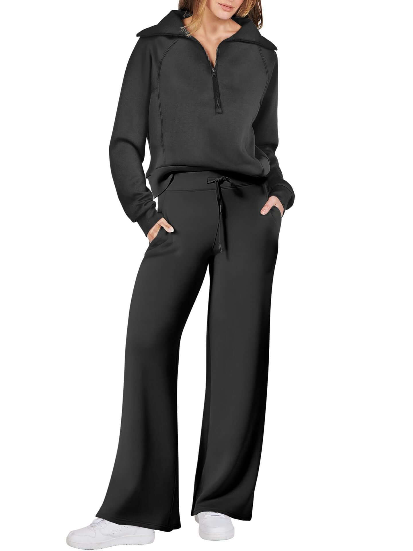 Women’s sports suit with wide-leg pants featuring a relaxed-fit top and loose wide-leg pant in black.