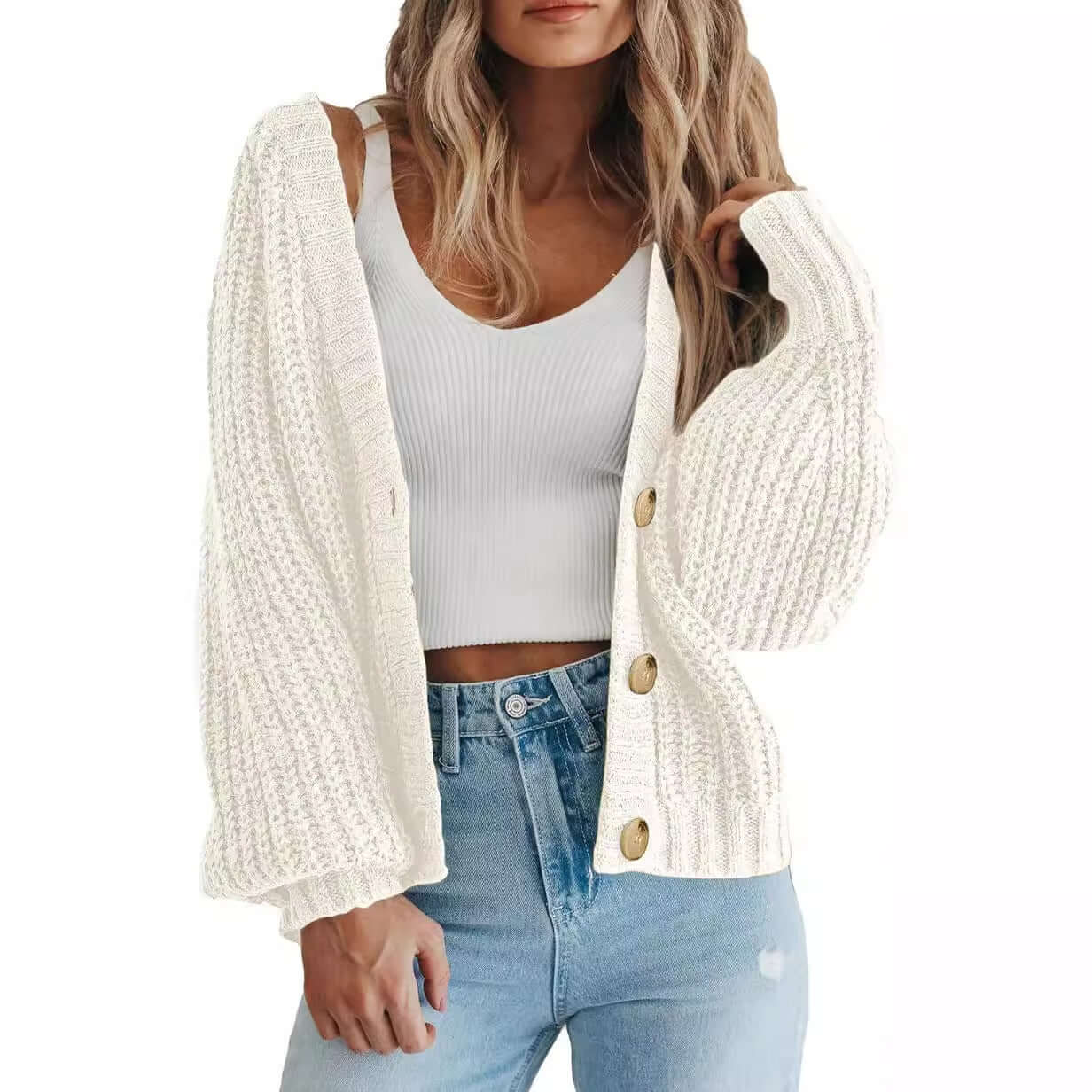 Women’s thick knitted cardigan sweater in cream, featuring long sleeves and button-down design, perfect for layering.