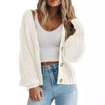 Women’s thick knitted cardigan sweater in cream, featuring long sleeves and button-down design, perfect for layering.