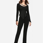 Solid color pajama set featuring a black long-sleeve top with a stylish design and matching pants, ideal for comfort and lounging.