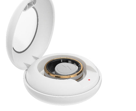 Smart fitness ring for men and women displayed in a white charging case.