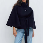 Model wearing a winter batwing sleeve coat with belt, showcasing elegant style and comfort in navy color.
