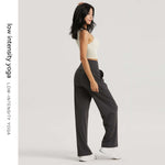 Model wearing VexoFinds women's moisture-wicking wide-leg pants for low-intensity yoga in a comfortable pose.