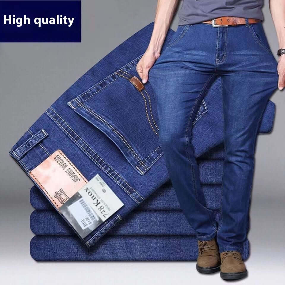 Stack of blue jeans with a person wearing them, on a gray background