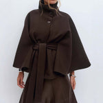 Winter batwing sleeve coat featuring a high neck and stylish belt, perfect for an elegant winter look.