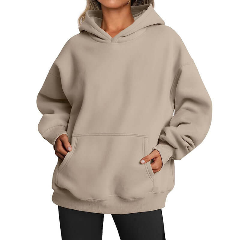 Beige hoodie worn by a person on a white background