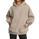 Beige hoodie worn by a person on a white background