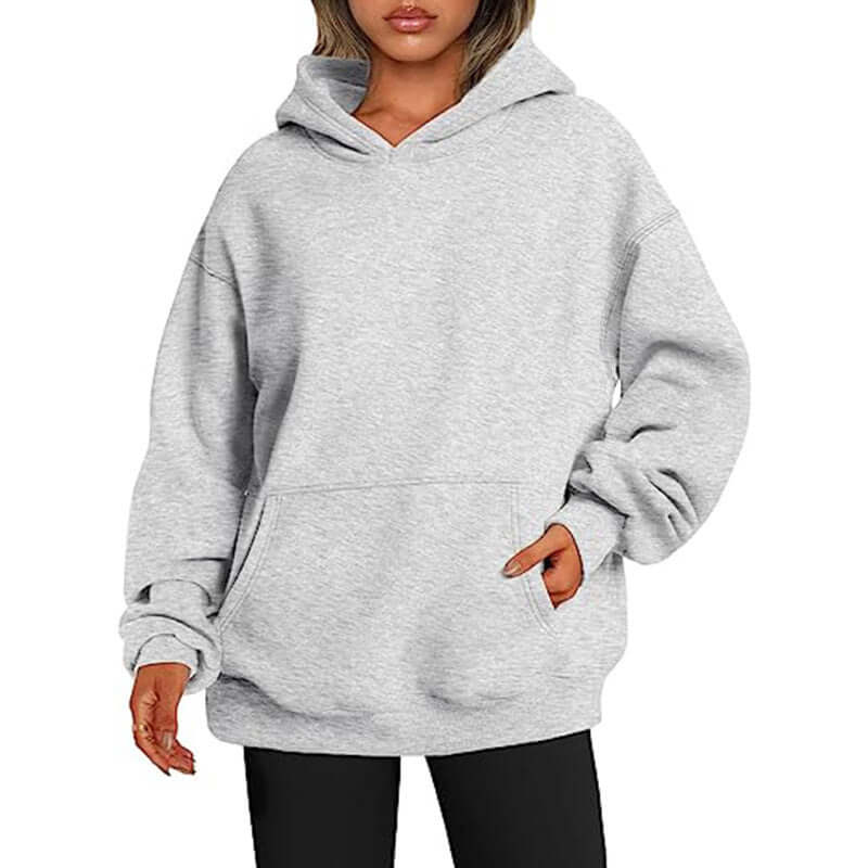 Gray hoodie worn by a person on a white background