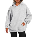Gray hoodie worn by a person on a white background