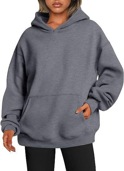 Gray hoodie worn by a person on a white background