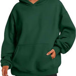 Green hoodie worn by a person on a white background