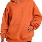 Orange hoodie worn by a person on a white background