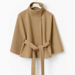 Winter batwing sleeve coat with belt in tan color, featuring a high neck and loose fit for stylish winter wear.