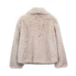 Back view of a plush winter coat for women, featuring a fluffy design and relaxed fit.