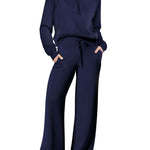Women’s sports suit with wide-leg pants featuring a relaxed-fit top and loose-fit design in navy blue.