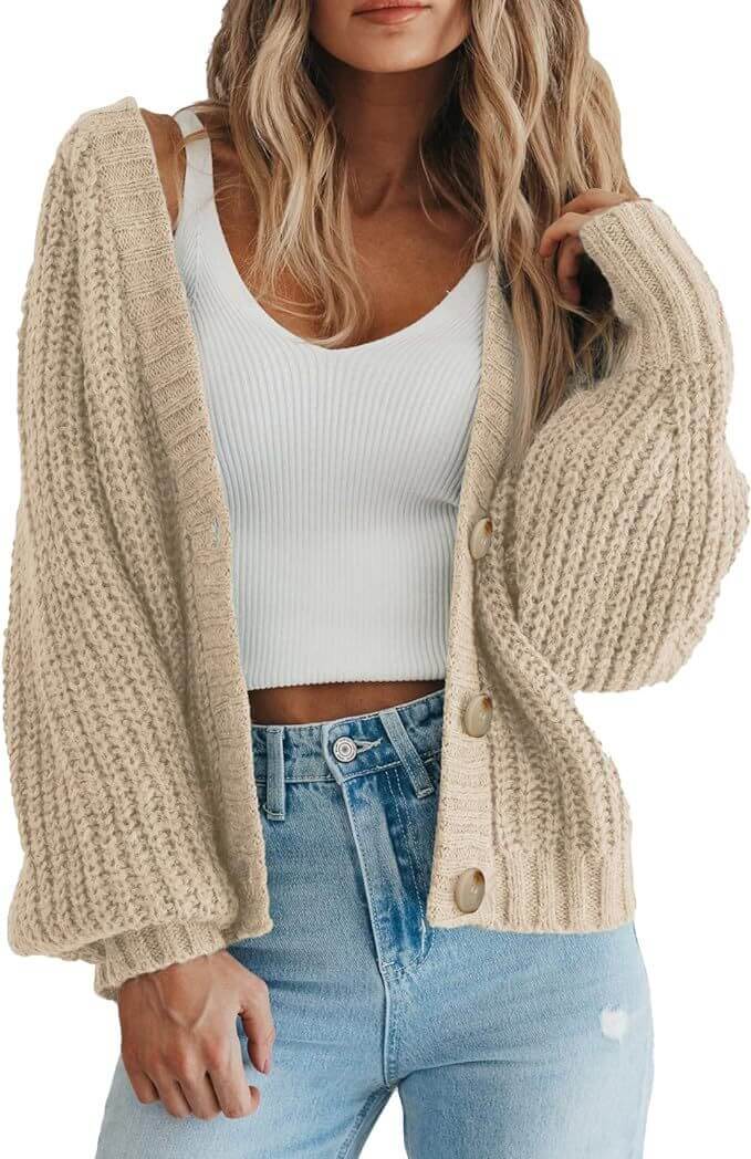 Women’s thick knitted cardigan sweater in beige, featuring a button-down design and cozy long sleeves.