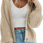 Women’s thick knitted cardigan sweater in beige, featuring a button-down design and cozy long sleeves.