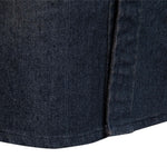 Close-up of a dark blue denim fabric with a zipper